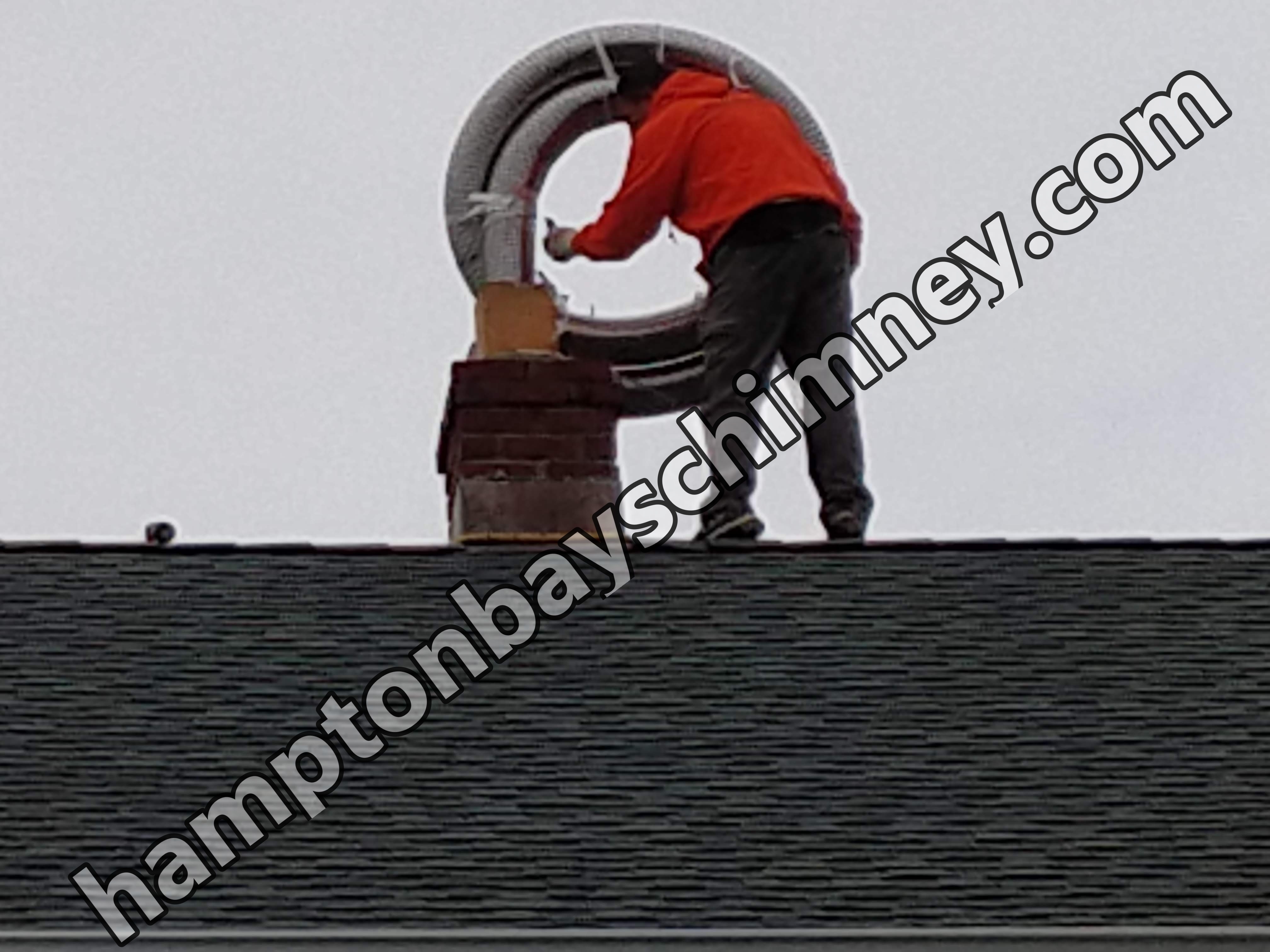 Flexible stainless chimney liner being installed in Hampton Bays, New York
